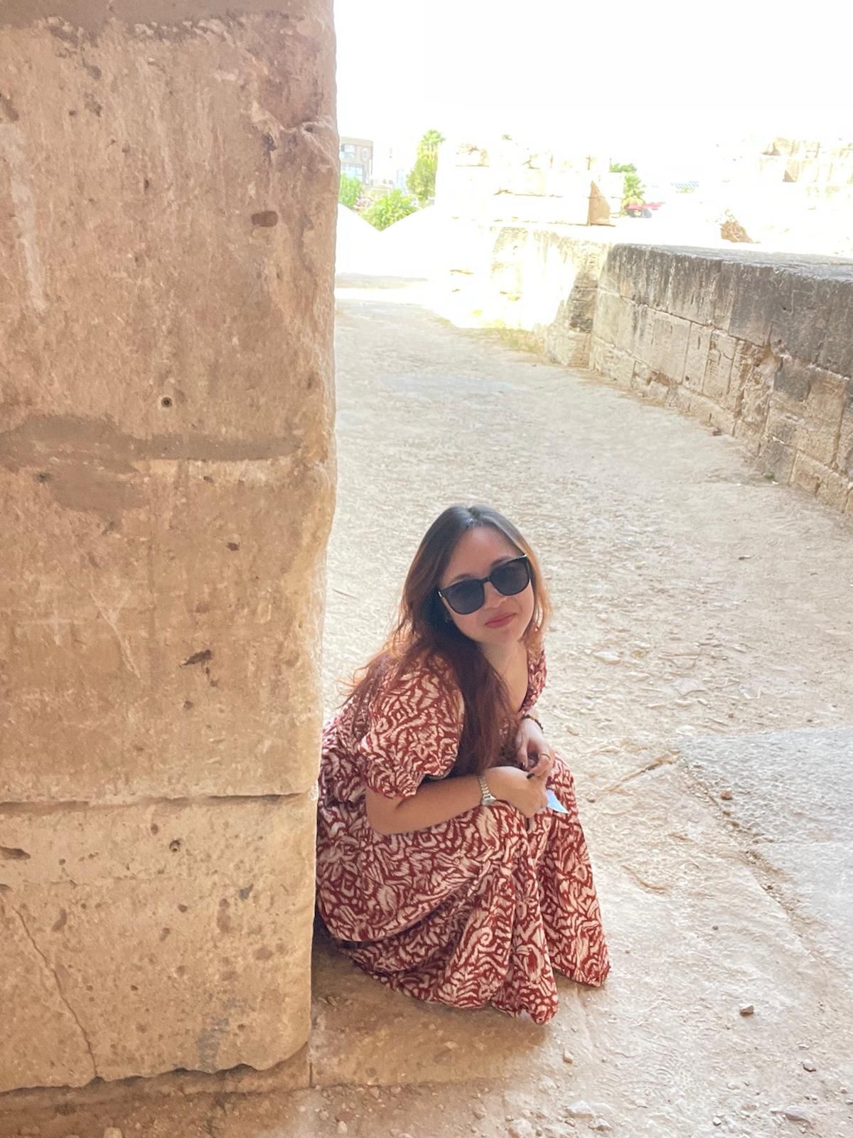 Tianyu sitting among ancient ruins